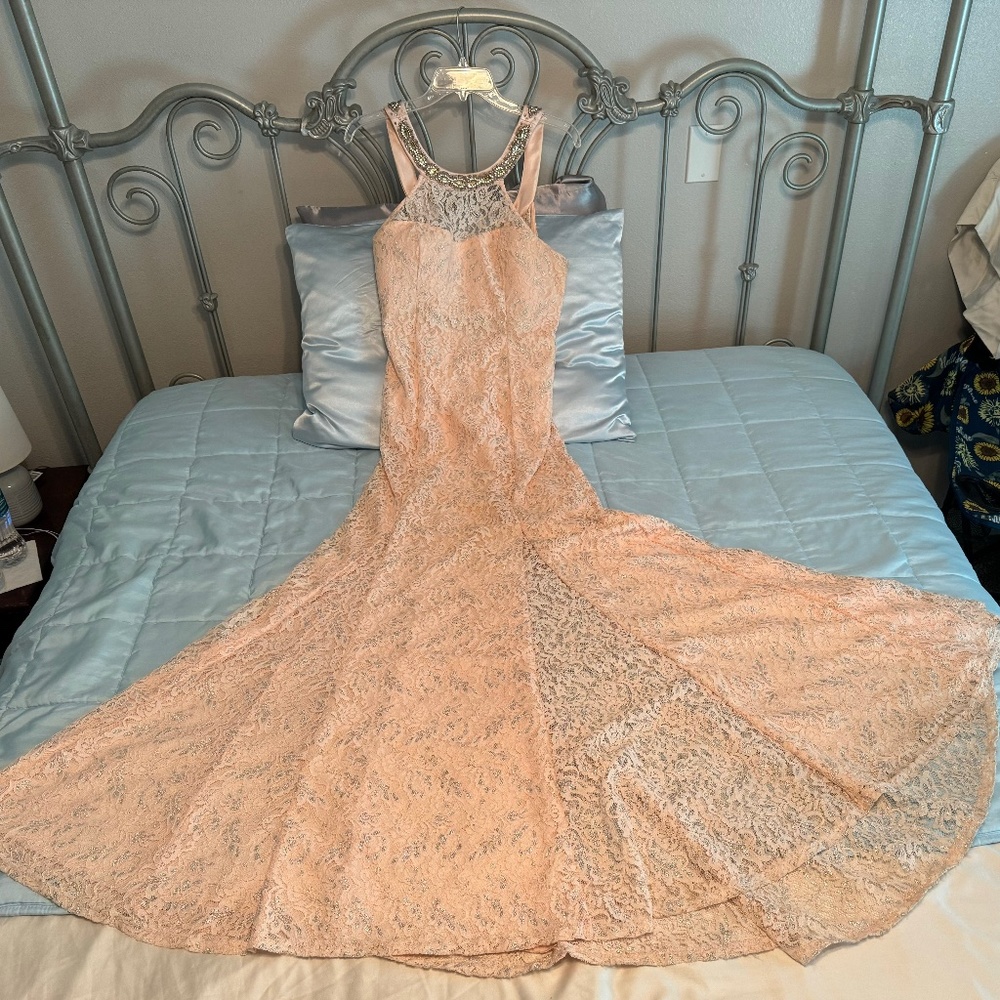Champagne colored floor length gown.